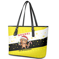Brunei Christmas Leather Tote Bag with Cartoon Monkey Santa Hat Candy Cane and Yellow Black Flag Pattern - Wonder Print Shop