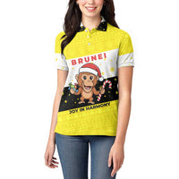 Brunei Christmas Women Polo Shirt with Cartoon Monkey Santa Hat Candy Cane and Yellow Black Flag Pattern - Wonder Print Shop