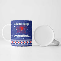 North Korea Christmas Ceramic Mug with Blue Pattern, Red Star, and Snowy Mountain Motif - Wonder Print Shop