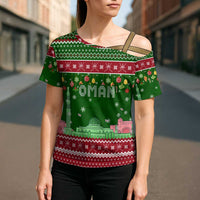 Oman Christmas Cross Shoulder Shirt with Green-Red Pattern, Mosque and Fort Landmarks, and Festive Ornament Motif - Wonder Print Shop