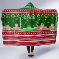 Oman Christmas Hooded Blanket with Green-Red Pattern, Mosque and Fort Landmarks, and Festive Ornament Motif - Wonder Print Shop