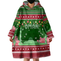 Oman Christmas Wearable Blanket Hoodie with Green-Red Pattern, Mosque and Fort Landmarks, and Festive Ornament Motif - Wonder Print Shop