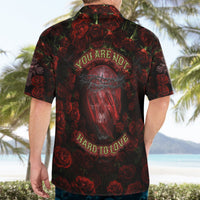 Back of dark red and black Hawaiian shirt, large rose skull graphic with bold text
