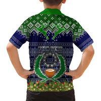 Kids' navy Hawaiian shirt with green collar, back view skull crest and holiday lights