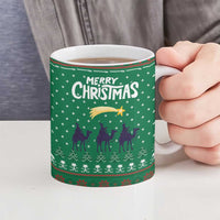 Saudi Arabia Christmas Ceramic Mug with Green Pattern, Traditional Script Motif, and Camel Caravan Silhouette - Wonder Print Shop