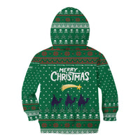Saudi Arabia Christmas Kid Hoodie with Green Pattern, Traditional Script Motif, and Camel Caravan Silhouette - Wonder Print Shop