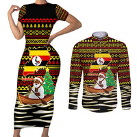 Uganda Christmas Couples Matching Short Sleeve Bodycon Dress and Long Sleeve Button Shirt with Santa in Canoe Christmas Tree Uganda Map Flag and Black Red Yellow Tribal Pattern Design - Wonder Print Shop