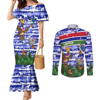 Gambia Christmas Couples Matching Mermaid Dress and Long Sleeve Button Shirt with Santa Birds Gift Boxes Forest Scene and Snowflake Pattern Design - Wonder Print Shop
