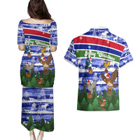 Gambia Christmas Couples Matching Puletasi and Hawaiian Shirt with Santa Birds Gift Boxes Forest Scene and Snowflake Pattern Design - Wonder Print Shop