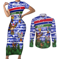 Gambia Christmas Couples Matching Short Sleeve Bodycon Dress and Long Sleeve Button Shirt with Santa Birds Gift Boxes Forest Scene and Snowflake Pattern Design - Wonder Print Shop
