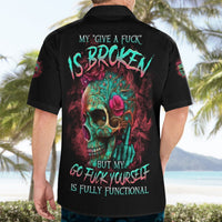 Black short-sleeve button-up shirt worn; large colorful skull back graphic