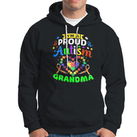 Black hoodie with colorful “Proud Autism Grandma” graphic and front pocket pouch