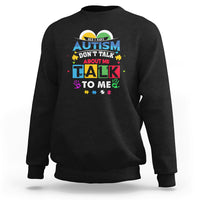 Black sweatshirt with colorful Autism slogan: "Don't Talk About Me, Talk To Me".