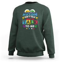 Dark forest green sweatshirt with colorful Autism slogan: "Don't Talk About Me, Talk To Me".
