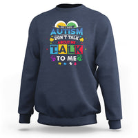 Navy sweatshirt with colorful Autism slogan: "Don't Talk About Me, Talk To Me".