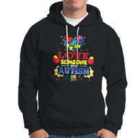Black autism-themed hoodie with colorful front graphic, drawstring hood, kangaroo pocket.