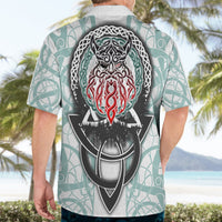 Light gray short-sleeve Hawaiian shirt worn by man, showing large black Odin back graphic