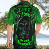 Black and green skull Hawaiian shirt on adult model, back neon text, short sleeves