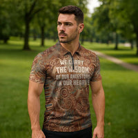 We Carry The Wisdom Zipper Polo Shirt African Ancient Symbols, Earthy Tones, and Ancestral Wisdom Quote - Wonder Print Shop