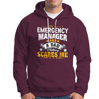 Maroon hoodie with “Emergency Manager” dad slogan graphic; front kangaroo pocket.