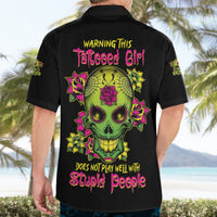 Black short-sleeve Hawaiian button shirt with back neon skull, roses, and warning text