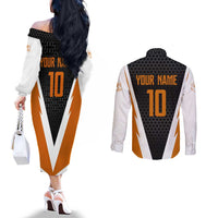 Bass Fishing Couples Matching Off The Shoulder Long Sleeve Dress and Long Sleeve Button Shirt Jumping Largemouth Fish on Black Hex Pattern and Orange White Lightning Accents - Wonder Print Shop