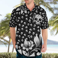 Black short-sleeve Hawaiian shirt worn by man, skull and white flower all-over print