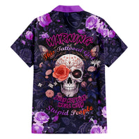 Hawaiian shirt with purple collar, dark floral print, skull and rose graphics, warning lettering