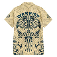 Tan Hawaiian shirt with blue warrior text and tribal skull back print, short sleeves
