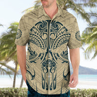 Tan Hawaiian shirt with blue tribal skull front print, camp collar, short sleeves