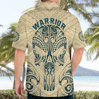 Tan Hawaiian shirt with blue warrior text and tribal skull back print, camp collar