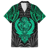 Hawaiian-style button-up shirt in black with bright green tiki and floral abstract print