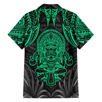 Hawaiian-style button-up shirt in black with bright green tiki face and ornate pattern