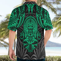 Back view of Hawaiian-style shirt with black base and bright green tiki artwork