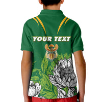 Kids green polo shirt with Your Text back print, crest and protea floral design