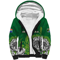 Green sherpa hoodie with white hood lining, black cuffs, South Africa flag sleeve prints