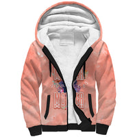Sherpa-lined pink hoodie with black drawstrings and large floral graphic on front
