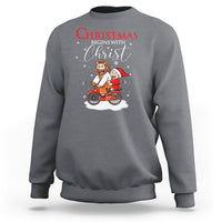 Christmas Begins With Christ Jesus Santa Riding Bicycle Sweatshirt - Wonder Print Shop