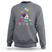 We Rise By Lifting Other Outer Space Astronaut Planet Balloon Motivational Quote Sweatshirt - Wonder Print Shop