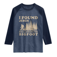 Retro I Found Jesus Still Looking Bigfoot Raglan Shirt Vintage Sasquatch Believer Funny Christian Humor