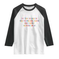 Be The Reason Someone Believes Recovery Is Possible Graphic Raglan Shirt