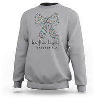 Be The Light Christmas Coquette Bow Sweatshirt Christian Religious Bible Verse - Wonder Print Shop
