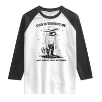 Funny God Is Testing Me And I Have Not Studied Raglan Shirt Cowboy Racoon
