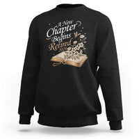 A New Chapter Begins Retired 2026 Sweatshirt Retired Teacher Floral Book - Wonder Print Shop