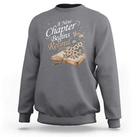 A New Chapter Begins Retired 2026 Sweatshirt Retired Teacher Floral Book - Wonder Print Shop
