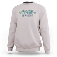 In A World Full Of Darkness Be A Light Sweatshirt Christmas Quote Gift - Wonder Print Shop