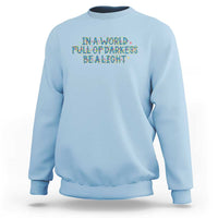In A World Full Of Darkness Be A Light Sweatshirt Christmas Quote Gift - Wonder Print Shop