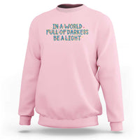 In A World Full Of Darkness Be A Light Sweatshirt Christmas Quote Gift - Wonder Print Shop