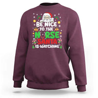 Christmas Nurse Sweatshirt Be Nice To The Nurse Santa Is Watching - Wonder Print Shop