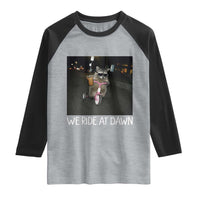 We Ride at Dawn Raglan Shirt Funny Racoon Riding Tricycle Chaotic Meme
